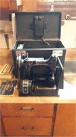 Minitaure Singer sewing machine in case.
