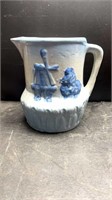 Early Windmill and Iris Stoneware pitcher in the
