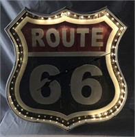 Route 66 metal clock sign.
