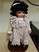 1990 Porcelain doll on stand