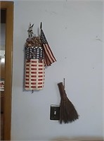American flag wall decor and a wall broom