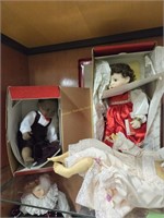 Shelf lot of collectors dolls as shown