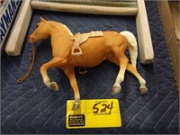 Saddled plastic horse