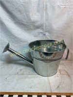 Large metal watering can planter