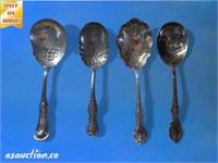 Four large serving spoons