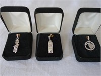 THREE STERLING SILVER CHARMS