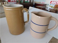 2 pottery pitchers