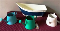 43-NEW DECORATIVE WATERING CANS AND BOAT-$65