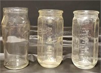 (2) Pyrex baby bottles and (1) 3 Rivers bottle