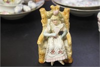 A Seated Ceramic Figure