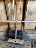 3 hand tools: shovel, broom, rake.