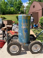 OLD PAINT SPRAYER CYLINDER ON ROLLER