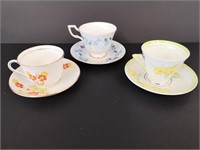 Three lovely teacups and saucers.