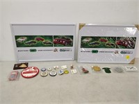 lot of pins, coins and a tin signs