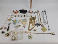 Costume jewelry necklaces, pins, bracelets,