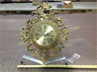 2 gold plastic framed battery wall clocks