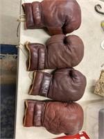 Two pair of professional boxing gloves