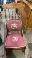 Small antique ladies rocking chair with a needle