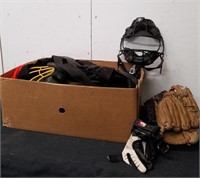 Box with baseball gear - mitts, gloves, pictures,