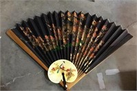 Large decorative oriental fan with beautiful