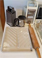 Graters, sifter, wood rolling pin, microwave tray