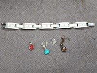 Men's stainless steel bracelet and 4 earrings.