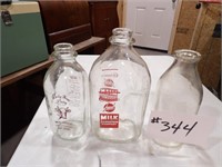 3) milk bottles