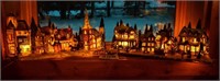 Pair of lite-up Christmas villages with