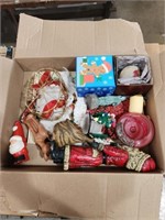 Box of nice Christmas decorations and candles.