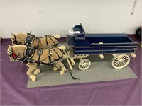 Set of horses pulling buckboard wagon