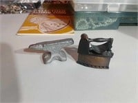miniature anvil and a iron pencil sharpener