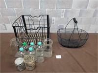 Vintage glass bottles, jars, and wire baskets