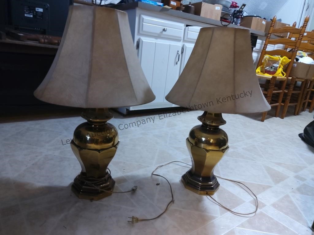 Two brass lamps with brown shades