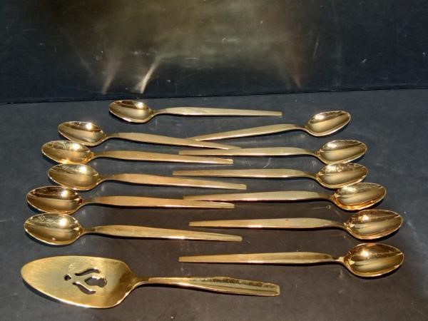 Gold colored tea spoons and Server