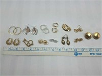 13 sets of gold and silver colored earrings