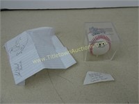 Baseball in Case with a Note and some Signatures