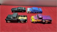 4 large diecast cars and trucks