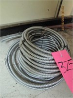 Roll electric wire wrapped in flex conduit approx