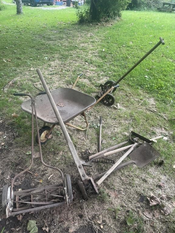 Vintage wheelbarrow, lawnmowers, tools, all to go