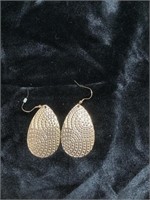 Metal earrings with raised detail