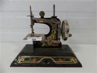 CASIGE TIN TOY SEWING MACHINE