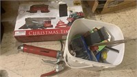 Bucket with miscellaneous tools, a grease gun,
