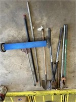 2 pair post hole diggers, shovel, pick axe, rock
