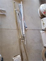 Assorted tension rods and curtain rods