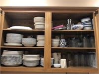Contents of cabinet. Plates, bowls, cups.