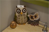 Trio of owl figurines