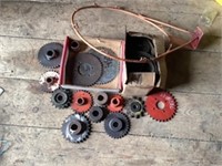 Box of new brake shoes, Box of various gears,