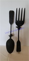 Old fork and spoon candle holders. 21 in. Long