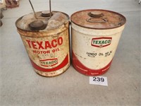 Two old Texaco 5 gal oil cans.