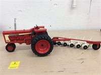 Farmall 806 with 5-bottom plow